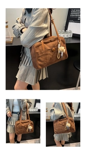 Detail view of large brown suede shoulder bag featuring a cute white alpaca charm pendant