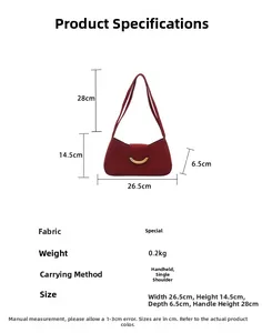 Detailed view of burgundy suede crescent bag with dimensions and gold hardware