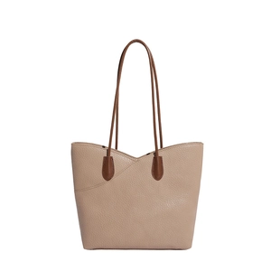 Minimalist large capacity grained leather tote bag with brown straps on white background