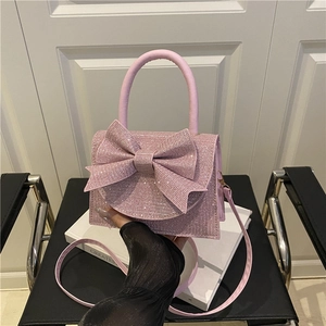 Rosa Glitzer-Mini-Handtasche mit großer Schleife und Umhängeriemen für elegante Damen