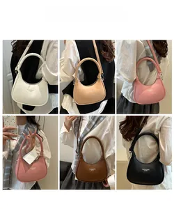 Collection of crescent moon bags in white, beige, pink, coffee, and black leather finishes