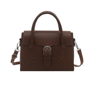 Minimalist deep brown retro shoulder bag with top handle and metal buckle on white background