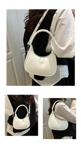 Detailed views of a white glossy crescent hobo bag with adjustable shoulder straps