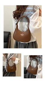 Close-up of brown matte leather crescent bag with white Fashion and Bags logo print
