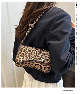 Close-up of leopard print shoulder bag with stylish knot detail on the strap