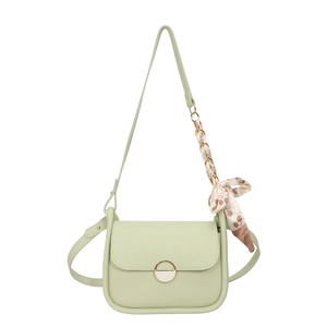 Chic mint green crossbody bag with golden buckle and silk scarf handle accent