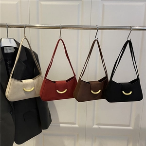 Retro square underarm bags in four colors with gold crescent buckle on white door