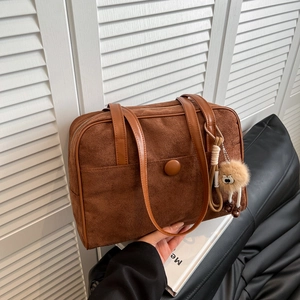 Caramel brown frosted faux suede tote bag with round buckle and plush charm for women