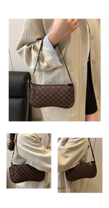 Detailed view of brown letter-print underarm bag with slim leather strap and tag