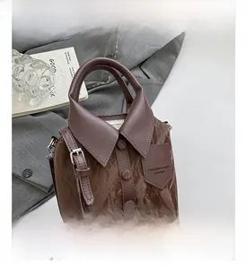 Detail of creative shirt-collar design handbag with decorative buttons and leather texture