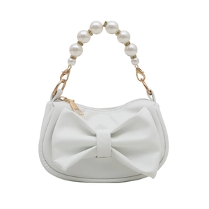 Elegant white crossbody bag with oversized bow and luxurious faux pearl handle