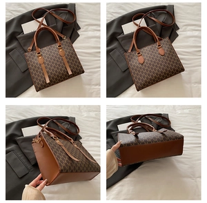 Detail view of large tote bag with M-pattern monogram and adjustable leather shoulder strap