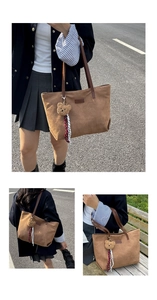 Close-up of brown corduroy tote bag featuring a cute plush bear charm and striped ribbon