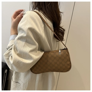 Detail of vintage monogram baguette bag with brown letter print and silver zipper