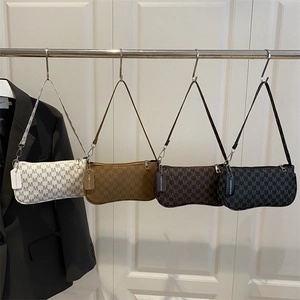 Chic crescent hobo bags with all-over M pattern in white, yellow, brown, and black