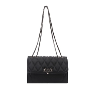 Quilted black leather crossbody bag with vintage rivet lock and metal chain strap