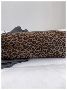 Detailed view of leopard print tote bag bottom with reinforced stitching and canvas texture