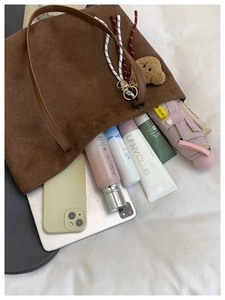 Brown suede tote bag interior showing large capacity for laptop, phone and cosmetics