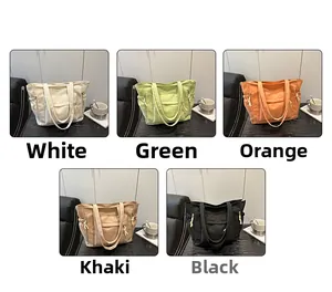Collage showing large canvas tote bags in five colors with drawstring side details