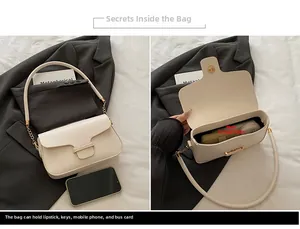 Internal view of a white PU leather shoulder bag showing capacity for phone and lipstick