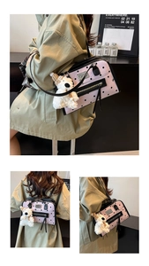 Detail of pink polka dot handbag featuring black leather trim and cute plush bear charm
