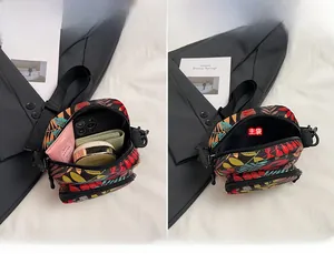 Detailed interior view of a compact crossbody bag showing main pockets and large capacity