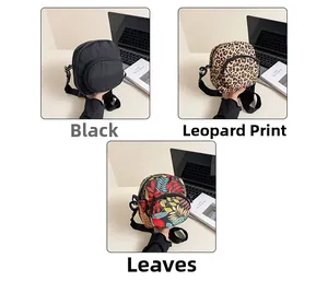 Three mini canvas crossbody bags in black, leopard, and leaf patterns with dual zippers