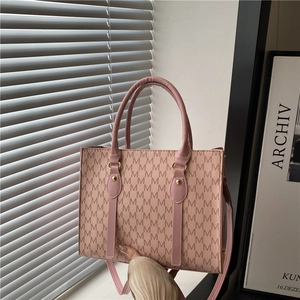 Pink tote bag with monogram pattern and gold hardware for women's stylish daily use
