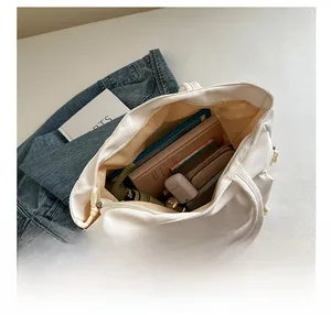 Spacious interior of a beige tote bag showing high capacity for daily essentials