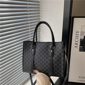 Classic black monogram tote bag with gold hardware and adjustable strap for women