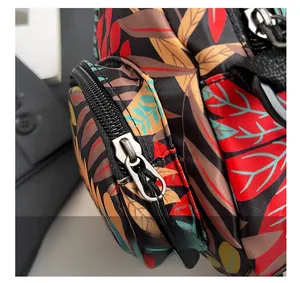 Detail of tropical leaf print bag with durable smooth metal side zipper pocket