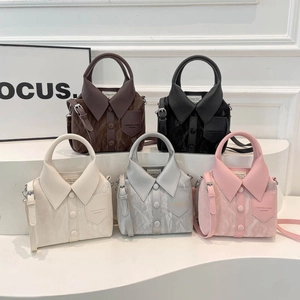 Unique shirt-collar style leather handbags in five colors shown on minimalist display