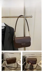 Detailed views of a vintage coffee brown crossbody bag with gold metal chain straps