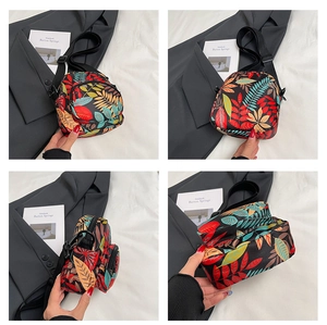 Detailed views of multi-compartment mini crossbody bag with vibrant tropical leaf patterns