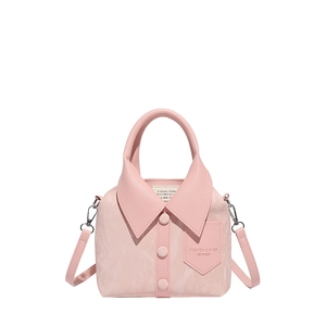 Pink shirt-style leather crossbody bag with button detail and top handle on white background