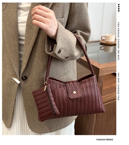 Detail of burgundy woven hobo bag set including main tote and matching coin purse