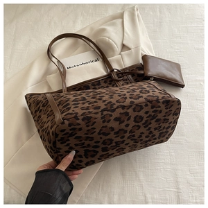 Detailed view of leopard print tote bag with small matching brown zip pouch for daily use