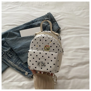 Detail of white leather mini backpack with black polka dots and hamburger embroidery