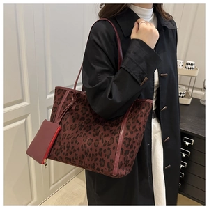 Detail of burgundy leopard print tote bag with matching small zippered hanging pouch