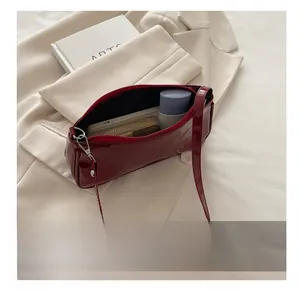 Interior view showing the storage capacity of a red patent leather baguette bag