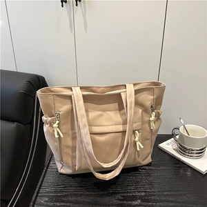 Large apricot nylon tote bag with functional pockets and drawstrings for daily commute