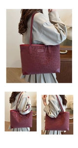 Macro shot of faux suede tote bag with leopard print and burgundy reinforced corner detail