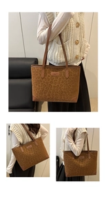 Macro detail of leopard print faux suede tote bag with reinforced leather corners and logo