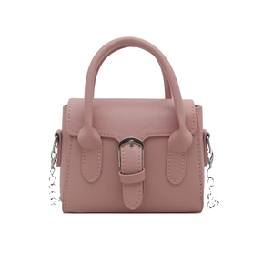 Pink matte faux leather crossbody bag with silver buckle and chain strap on white background