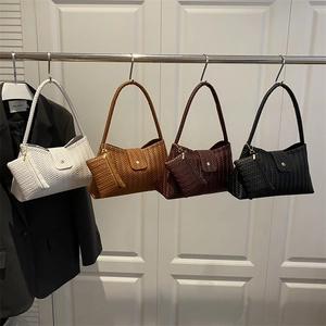 Chic woven tote bag with matching pouch in white, brown, and black neutral colors