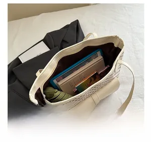 Internal view of the large tote bag showing high capacity for iPad, books and umbrella