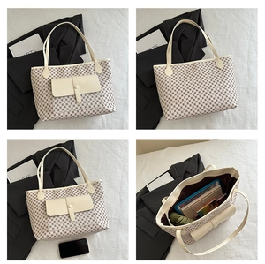 Macro details of beige checkered tote bag showing spacious interior and vegan leather pocket