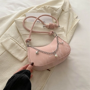 Pink crescent shoulder bag with marble texture and heart charm chain strap