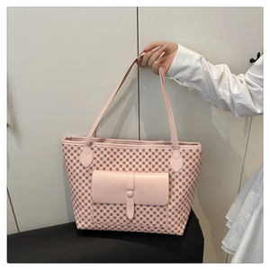 Detail of light pink tote bag with geometric pattern and front flap pocket