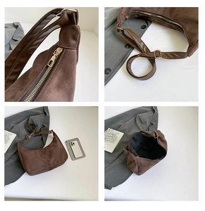 Vista detallada del bolso hobo de ante marrón con cremallera, correa y estructura interior